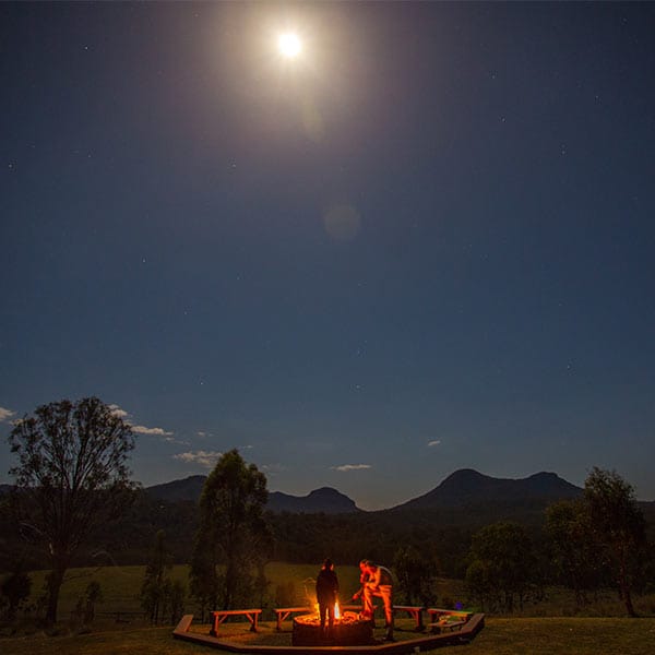 Outback campfire with moon high in the sky - Inbound Tour Operator Australia - Learn more about 39 Degrees South Outback campfire with moon high in the sky - Inbound Tour Operator Australia - Learn more about 39 Degrees South